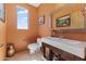 Stylish powder room with a modern vanity, vessel sink, and colorful walls, enhancing the home's charm at 28729 N 107Th St, Scottsdale, AZ 85262
