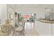 Dining area featuring elegant glass table and chairs with views to the pool area at 28729 N 107Th St, Scottsdale, AZ 85262