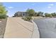 Desert home featuring large driveway with easy access and professional desert landscaping at 28729 N 107Th St, Scottsdale, AZ 85262