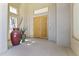 Grand entryway features double wooden doors, neutral walls, and decorative vases at 28729 N 107Th St, Scottsdale, AZ 85262