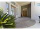 Inviting front entrance with a custom glass door and lush desert landscaping at 28729 N 107Th St, Scottsdale, AZ 85262
