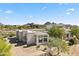 Desert home with uniquely architecture, mature trees, desert landscape, and mountain views at 28729 N 107Th St, Scottsdale, AZ 85262