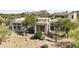 Landscaped desert home featuring native plants, stone accents, and a welcoming walkway at 28729 N 107Th St, Scottsdale, AZ 85262