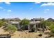 Desert home featuring mature landscaping, natural rock accents, and desert views at 28729 N 107Th St, Scottsdale, AZ 85262