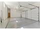 Spacious three car garage with finished flooring and multiple entry points at 28729 N 107Th St, Scottsdale, AZ 85262