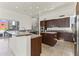 Open kitchen featuring stainless steel appliances and expansive granite countertops at 28729 N 107Th St, Scottsdale, AZ 85262