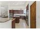 Spacious kitchen with an island, stainless steel appliances, and dark wood cabinets offering storage at 28729 N 107Th St, Scottsdale, AZ 85262