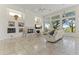 Bright living room with a fireplace, custom shelving, and views at 28729 N 107Th St, Scottsdale, AZ 85262