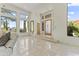 Bright living room with tile floors, large windows, and comfortable seating at 28729 N 107Th St, Scottsdale, AZ 85262