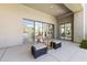 Cozy outdoor patio featuring comfortable seating and sliding glass doors, ideal for relaxing and entertaining guests at 28729 N 107Th St, Scottsdale, AZ 85262