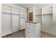 Well-organized walk-in closet featuring ample shelving, drawers, and hanging space at 28729 N 107Th St, Scottsdale, AZ 85262