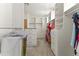 Large walk-in closet provides abundant storage with custom shelving and hanging rods for clothes and accessories at 28729 N 107Th St, Scottsdale, AZ 85262