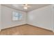 Bright bedroom featuring hardwood floors and a large window for natural light at 3046 E Dover St, Mesa, AZ 85213