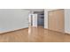 Neutral bedroom with hardwood floors and closet doors for storage at 3046 E Dover St, Mesa, AZ 85213