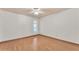 Neutral bedroom with hardwood floors and a window allowing natural light to fill the room at 3046 E Dover St, Mesa, AZ 85213