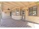 Cozy covered patio featuring shaded lounge area and back door with pet door at 3046 E Dover St, Mesa, AZ 85213