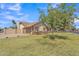 Lovely one-story residence boasting a lush green lawn and an attached two-car garage at 3046 E Dover St, Mesa, AZ 85213
