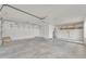 Spacious garage interior with storage shelving and access door to backyard at 3046 E Dover St, Mesa, AZ 85213