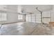 A spacious two-car garage features a concrete floor, neutral white walls, and a large window for natural light at 3046 E Dover St, Mesa, AZ 85213