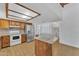 Kitchen with island, stainless steel refrigerator, wooden cabinets, and plenty of counter space at 3046 E Dover St, Mesa, AZ 85213