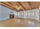 Bright living room with fireplace and high ceilings, opening to outdoor views and natural light at 3046 E Dover St, Mesa, AZ 85213