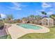 Inviting backyard with a private swimming pool, patio area, and lush greenery at 3046 E Dover St, Mesa, AZ 85213