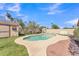 Sparkling pool and backyard with storage shed and lush landscaping at 3046 E Dover St, Mesa, AZ 85213