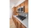 Bright kitchen showcasing updated cabinets, stainless steel appliances, and patterned backsplash at 3307 W Mescal St, Phoenix, AZ 85029