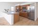 Modern kitchen featuring stainless steel appliances, ample cabinetry, and a stylish island with breakfast bar at 3307 W Mescal St, Phoenix, AZ 85029