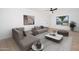 Comfortable living room with neutral-toned furnishings, a large window, and modern decor at 3307 W Mescal St, Phoenix, AZ 85029