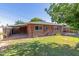 Cozy brick home with a well maintained lawn and a covered patio at 3538 W Sierra Vista Dr, Phoenix, AZ 85019