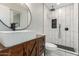 Modern bathroom featuring a vessel sink, wood vanity, and walk-in shower with niche at 3538 W Sierra Vista Dr, Phoenix, AZ 85019