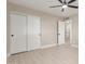 Bright bedroom featuring a ceiling fan, neutral wall paint, and closet at 3538 W Sierra Vista Dr, Phoenix, AZ 85019