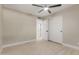 Bright bedroom featuring a ceiling fan, neutral wall paint, and large closet at 3538 W Sierra Vista Dr, Phoenix, AZ 85019