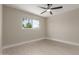 Bright bedroom featuring a ceiling fan, natural light, and neutral wall paint at 3538 W Sierra Vista Dr, Phoenix, AZ 85019