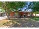 Charming brick home featuring mature trees and a well-maintained lawn at 3538 W Sierra Vista Dr, Phoenix, AZ 85019