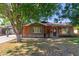 Charming brick home featuring mature trees and a well-maintained lawn at 3538 W Sierra Vista Dr, Phoenix, AZ 85019