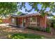 Charming brick home featuring mature trees and updated front windows at 3538 W Sierra Vista Dr, Phoenix, AZ 85019