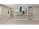 Modern kitchen featuring white cabinetry, quartz countertops, stainless appliances, and large island at 3538 W Sierra Vista Dr, Phoenix, AZ 85019