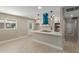 Spacious kitchen with quartz countertops, stainless appliances, modern island, and bright white cabinets at 3538 W Sierra Vista Dr, Phoenix, AZ 85019