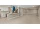 Bright, open kitchen boasts quartz counters, stainless appliances, and eye-catching blue vent hood at 3538 W Sierra Vista Dr, Phoenix, AZ 85019