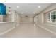 Bright open-concept living room with wood floors and recessed lighting at 3538 W Sierra Vista Dr, Phoenix, AZ 85019