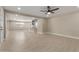 Spacious living room featuring wood floors and a ceiling fan at 3538 W Sierra Vista Dr, Phoenix, AZ 85019