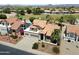 Birds-eye view showcasing a home with a tile roof near a lush green golf course, perfect for relaxation at 4002 N San Gabriel Cir, Mesa, AZ 85215