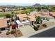 Aerial view of a home boasting desert landscaping, a tile roof, and proximity to a golf course at 4002 N San Gabriel Cir, Mesa, AZ 85215