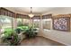 Bright breakfast nook with three large windows and light tile floor that brings in natural light and is adjacent to the backyard at 4002 N San Gabriel Cir, Mesa, AZ 85215