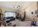 Comfortable living room with vaulted ceilings and plenty of natural light; perfect as a home office or study area at 4002 N San Gabriel Cir, Mesa, AZ 85215