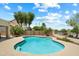 A lovely kidney-shaped pool with desert landscaping surrounding the pool area at 4002 N San Gabriel Cir, Mesa, AZ 85215