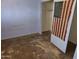 This is a rundown bedroom with closet and an american flag leaning on a wall at 4110 E Wagoner Rd, Phoenix, AZ 85032