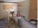 The garage space, needs flooring, featuring open storage, tools, and utility items for the handy homeowner at 4110 E Wagoner Rd, Phoenix, AZ 85032